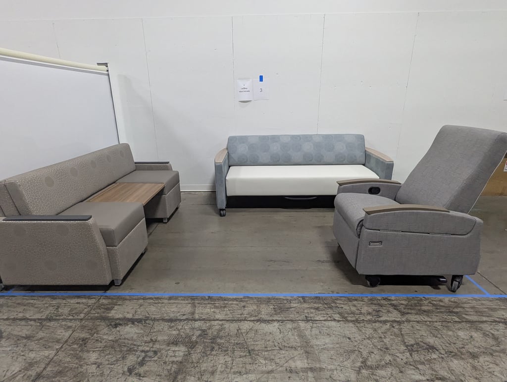 Two sofas and a recliner at the La-Z-Boy Healthcare booth, number 3