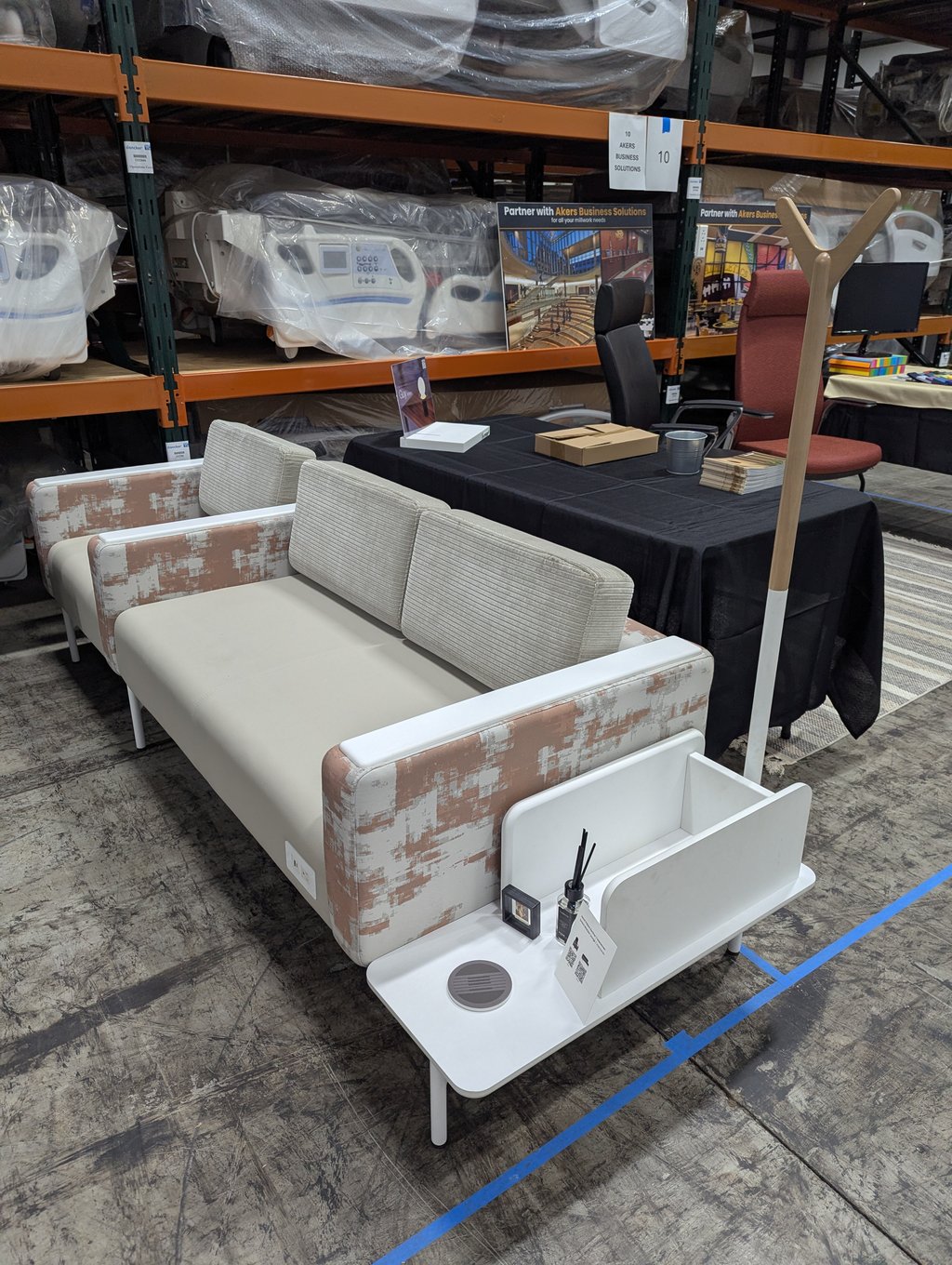 Sofas, chairs and a table at the Akers Business Solutions booth, number 10