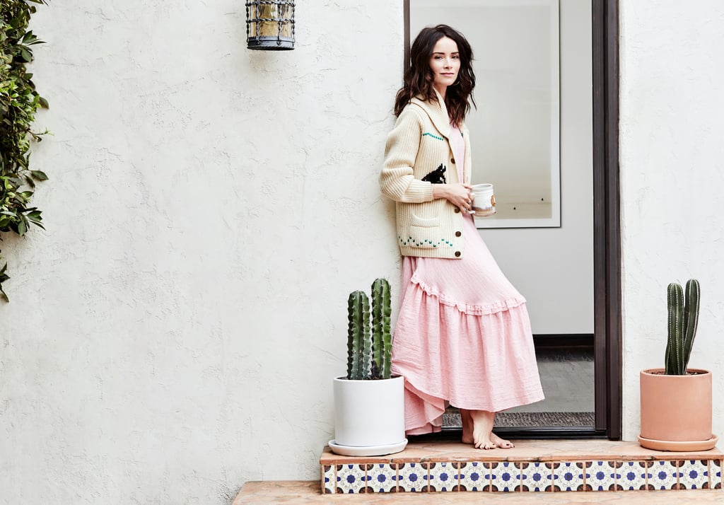Abigail Spencer photographed outdoors, wrapped in a white robe