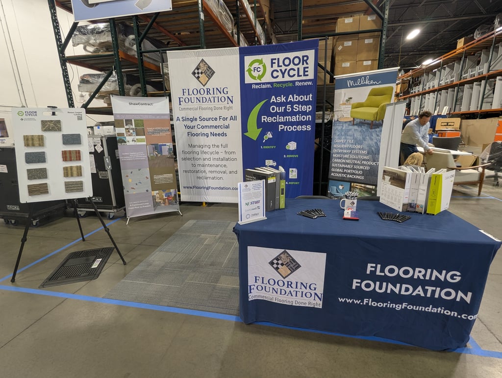 The Flooring Foundation and Floor Cycle booth with its reclamation process banners