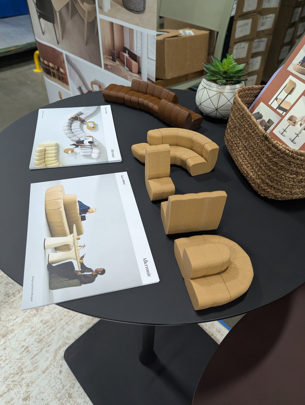 Allermuir sofa module samples and brochures arranged on a round table