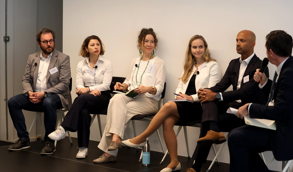 Speakers on stage at a sustainability forum