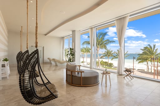 Hotel lounge and bar framed by three tall wooden arches