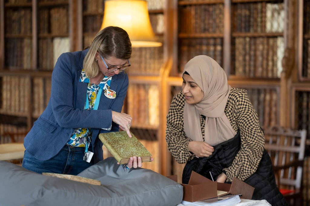 Staff member giving a talk in the Library at Blickling Estate, Norfolk
