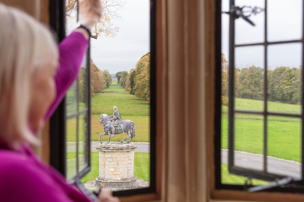 Person looking out of a window at Hartwell House, Buckinghamshire, towards the statue of Frederick, Prince of Wales.