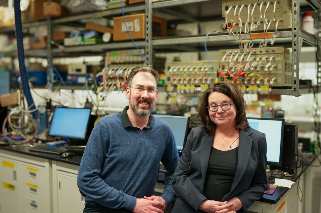 Dr. Linda Nazar and Dr. Michael Pope posing for a photograph in their lab.