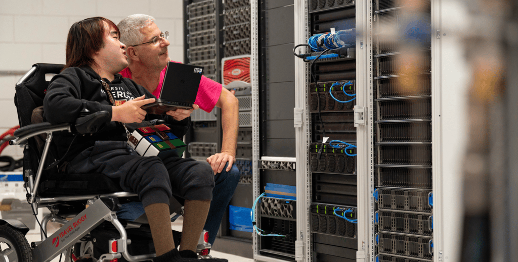 Peter Cai and Martin Karsten collaborating at the data servers.